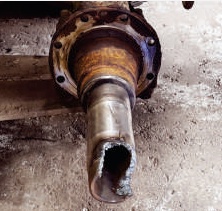 Mack truck spindle before replacement with a large break in the spindle end