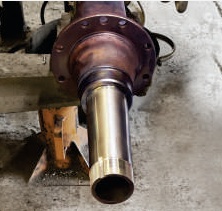 Mack truck spindle after replacement, machined and fitted to the axle
