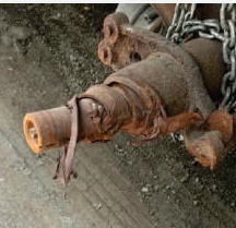 Tapered trailer spindle before replacement, heavily corroded and scored